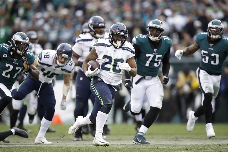 Seattle Seahawks' Rashaad Penny (20) runs for a touchdown during the second half of an NFL football game against the Philadelphia Eagles, Sunday, Nov. 24, 2019, in Philadelphia. (AP Photo/Matt Rourke)