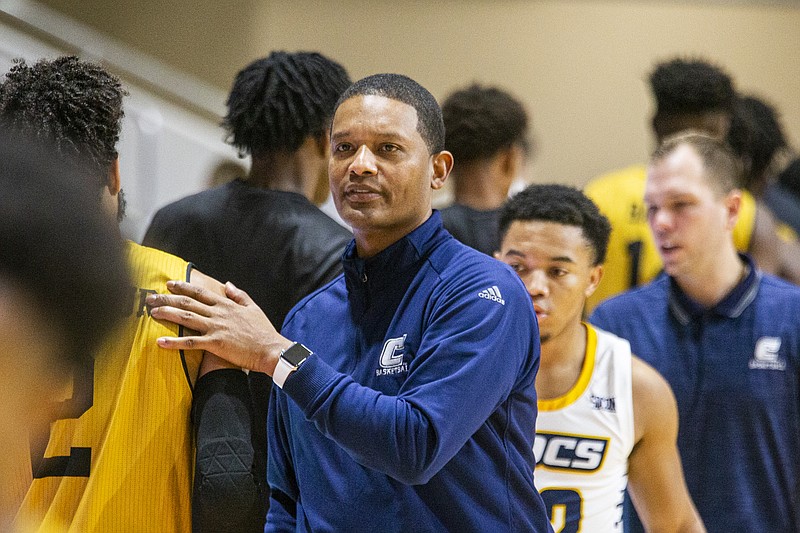 Chattanooga head coach Lamont Paris congratulates Alabama State players after an NCAA college basketball game at the Emerald Coast Classic in Niceville, Fla., Friday, Nov. 29, 2019. Chattanooga defeated Alabama State 74-56. (AP Photo/Mark Wallheiser)