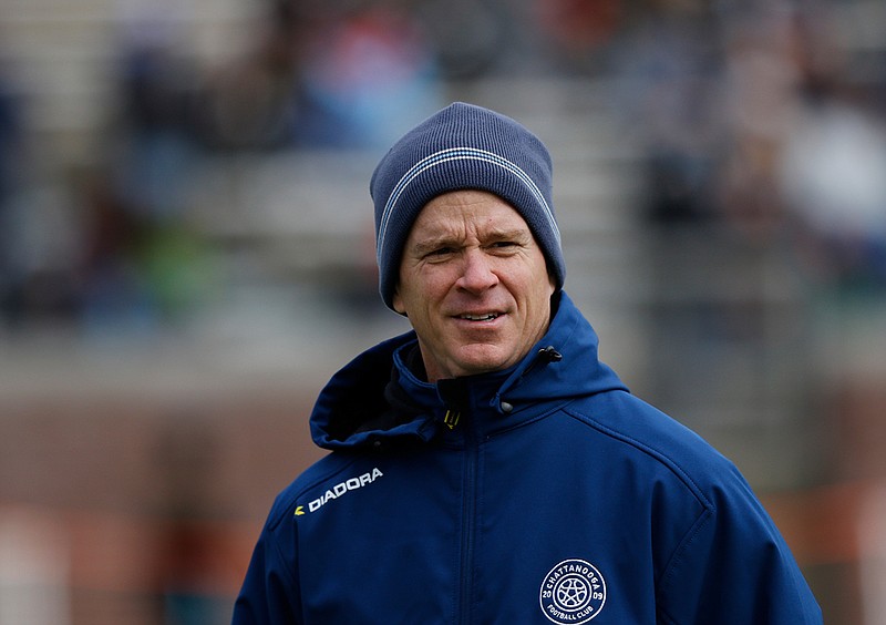 Chattanooga Football Club's Bill Elliott watches as players warm up for an exhibition against Major League Soccer's FC Dallas on Feb. 3, 2018, at Finley Stadium. Elliott, the team's head coach for the past eight seasons and its general manager in 2019, will become CFC's technical director as Peter Fuller takes over as head coach for the 2020 season. / Staff file photo