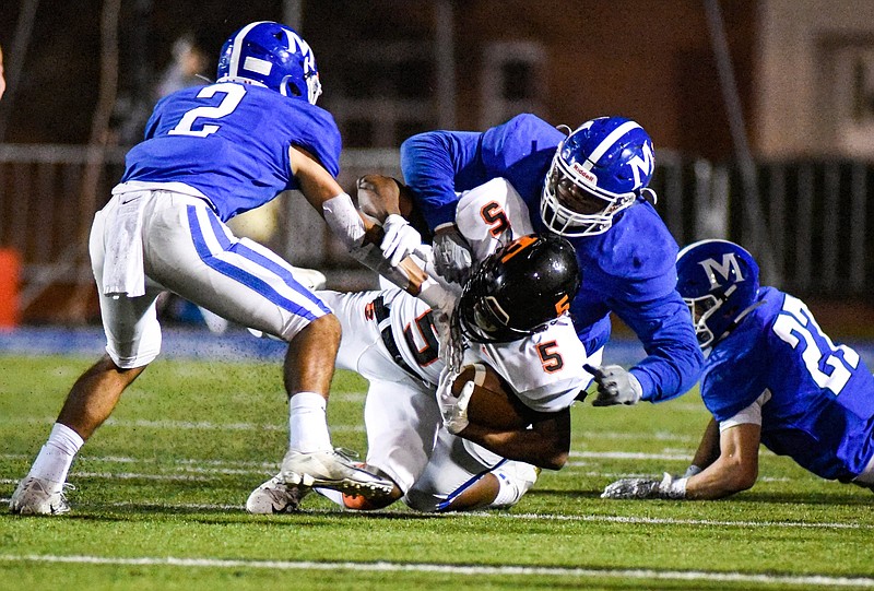 McCallie defenders tackle Ensworth's Charles Ingram V in the backfield during a TSSAA Division II-AAA semifinal Nov. 22 at Spears Stadium. / Photo by Cade Deakin
