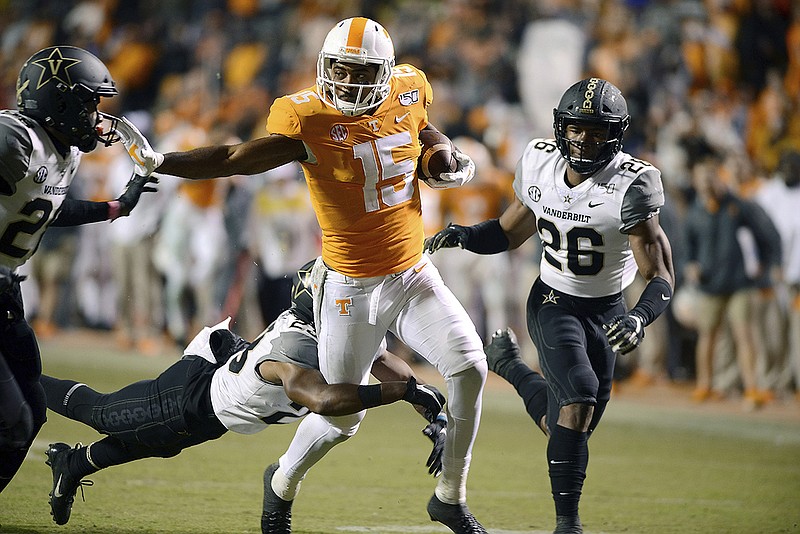 Tennessee wide receiver Jauan Jennings tries to shake Vanderbilt defenders during the second half of last Saturday's game in Knoxville. The SEC has ruled Jennings, a fifth-year senior, must sit out the first half of the Vols' upcoming bowl game for committing a flagrant personal foul against Vanderbilt that was not called at the time. The league office determined the foul and announced the suspension after reviewing video of the game. / AP photo by Scott Keller