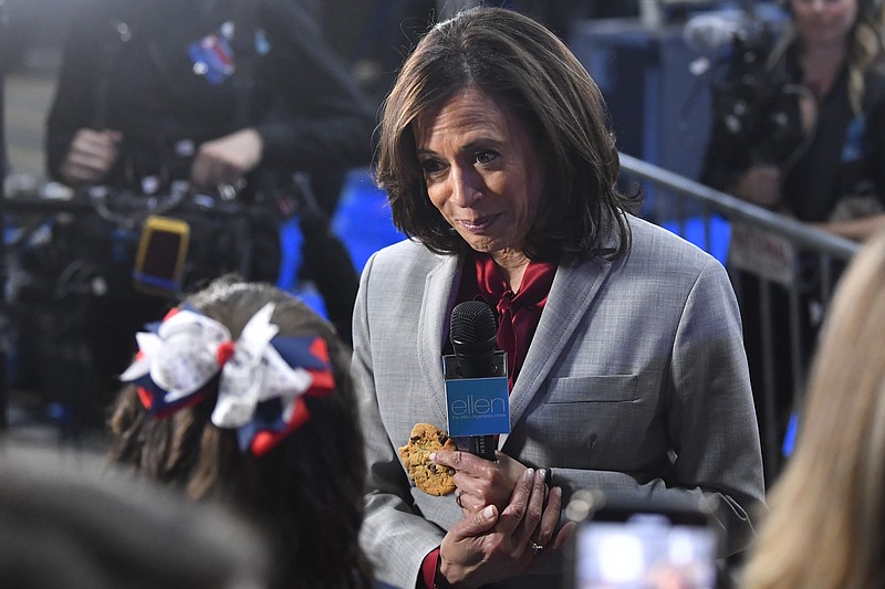 In this Nov. 21, 2019, file photo, then-Democratic presidential candidate Sen. Kamala Harris, D-Calif., listens to a question in the spin room after a Democratic presidential primary debate in Atlanta. (AP Photo/John Amis, File)