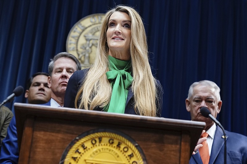 Businesswoman Kelly Loeffler speaks after she was introduced by Georgia Gov. Brian Kemp as his pick to fill Georgia's vacant U.S. Senate seat at the Georgia State Capitol on Wednesday, Dec. 4, 2019, in Atlanta. (AP Photo/Elijah Nouvelage)