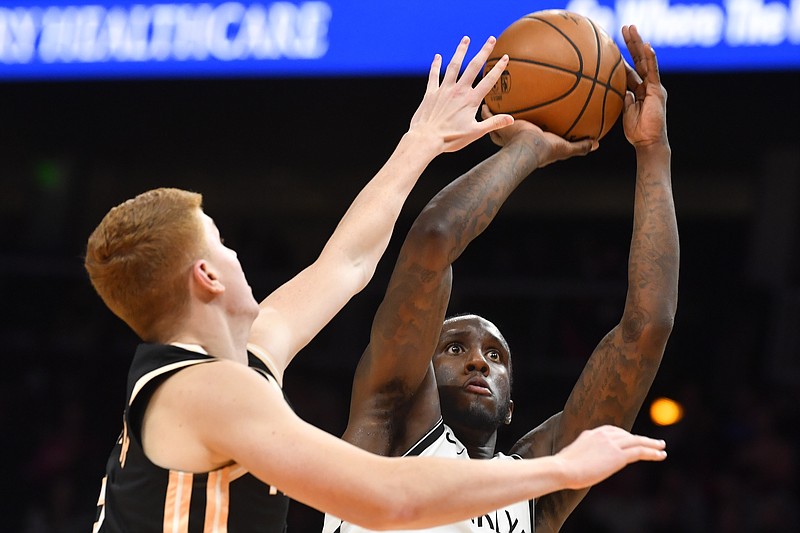 Brooklyn Nets forward Taurean Prince shoots as Atlanta Hawks guard Kevin Huerter defends during the first half Wednesday night in Atlanta. / AP photo by John Amis