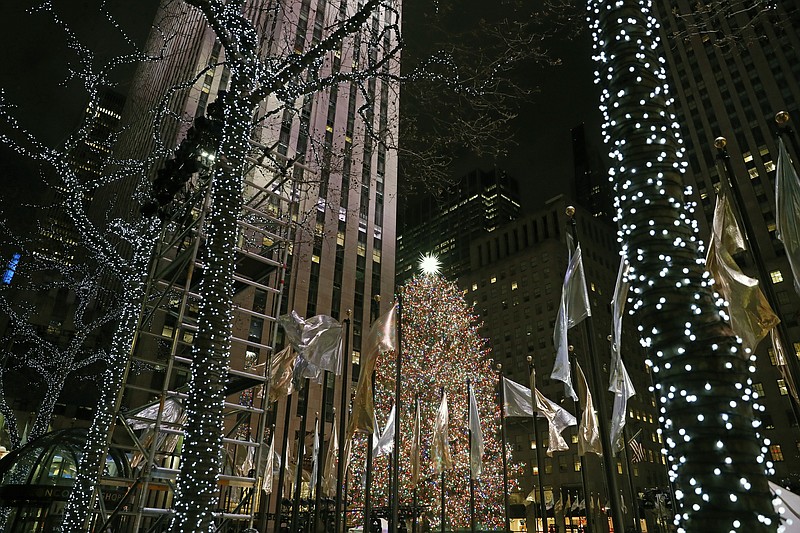 Decorative lights abound after the 87th annual Rockefeller Center Christmas Tree lighting ceremony, Wednesday, Dec. 4, 2019, at Rockefeller Center in New York. (AP Photo/Kathy Willens)