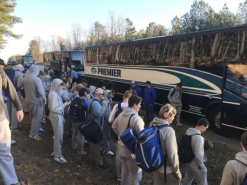 McCallie football players wait to board a backup charter after one of the team's primary buses broke down on the way to Cookeville for Thursday night's BlueCross Bowl Division II-AAA state championship game. / Staff photo by Stephen Hargis