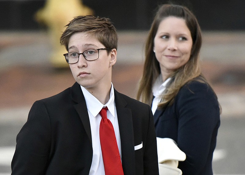 In a Monday, Dec. 11, 2017 file photo, transgender teen Drew Adams, left, leaves the U. S. Courthouse with his mother Erica Adams Kasper after the first day of his trial about bathroom rights at Nease High School, in Jacksonville, Fla. The transgender student's fight over school bathrooms comes before a federal appeals court Thursday, Dec. 5, 2019, setting the stage for a groundbreaking ruling. Drew Adams, who has since graduated from Nease High School in Ponte Vedra, won a lower court ruling in 2018 ordering the St. Johns County school district to allow him to use the boys' restroom. (Will Dickey/The Florida Times-Union via AP, File)