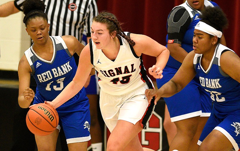 Signal Mountain's Olivia Koontz (45) breaks downcourt between Red Bank's Arteya Scott (13) and Raijeria Bell during her Lady Eagles' comeback win Friday night at home. Koontz scored 21 points in the 51-45 victory. / Staff photo by Robin Rudd