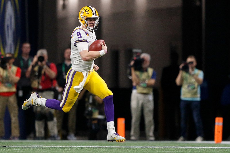 LSU quarterback Joe Burrow runs the ball during the Tigers' win against Georgia in the SEC title game last Saturday at Mercedes-Benz Stadium in Atlanta. / Staff photo by C.B. Schmelter