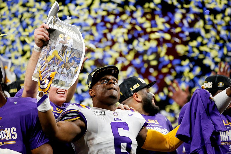 LSU linebacker Jacob Phillips (6) celebrates after the Tigers routed Georgia in the SEC title game last Saturday at Mercedes-Benz Stadium  in Atlanta. / Staff photo by C.B. Schmelter