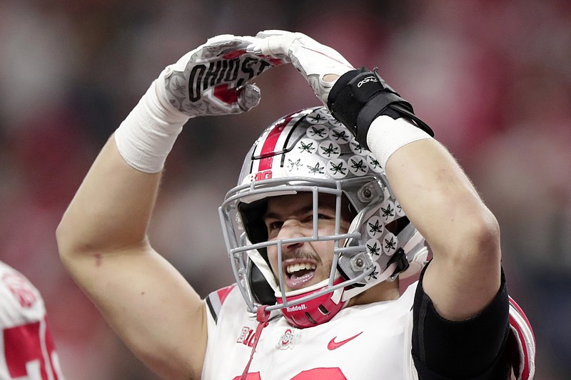 Ohio State tight end Jeremy Ruckert celebrates after scoring a touchdown during the second half of the Big Ten championship game against Wisconsin on Saturday in Indianapolis. / AP photo by Michael Conroy