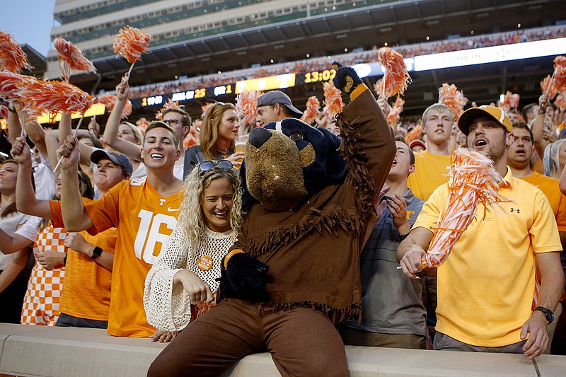 Tennessee mascot Smokey cheers with fans during the Vols' 43-14 loss to Georgia on Oct. 5 at Neyland Stadium. The Vols dropped to 1-4 with that loss but have won six of seven games since and will face Indiana (8-4) in the Gator Bowl on Jan. 2 in Jacksonville, Fla. / Staff photo by C.B. Schmelter
