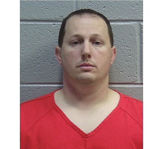 This jail mugshot from the Lincoln County Sheriff's Office in Georgia shows Army Maj. Jason Musgrove, who was jailed after federal authorities charged him with distributing child pornography. Court records say an FBI agent monitoring an online chatroom observed a person sharing nude photos of a teenage girl on Dec. 5, 2019. The agent said he traced the user's computer IP address to Musgrove's home. Musgrove is assigned to the Army Cyber Command at Fort Gordon, Georgia, where he holds a top-secret security clearance, according to court records. (Lincoln County Sheriff's Office via AP)