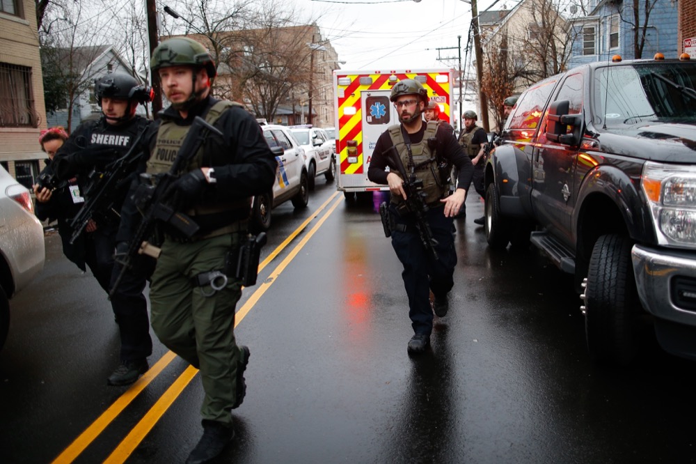 Antiterrorism unit arrive to the scene of a shooting in Jersey City, Tuesday, Dec. 10, 2019, in New Jersey. (AP Photo/Eduardo Munoz Alvarez)