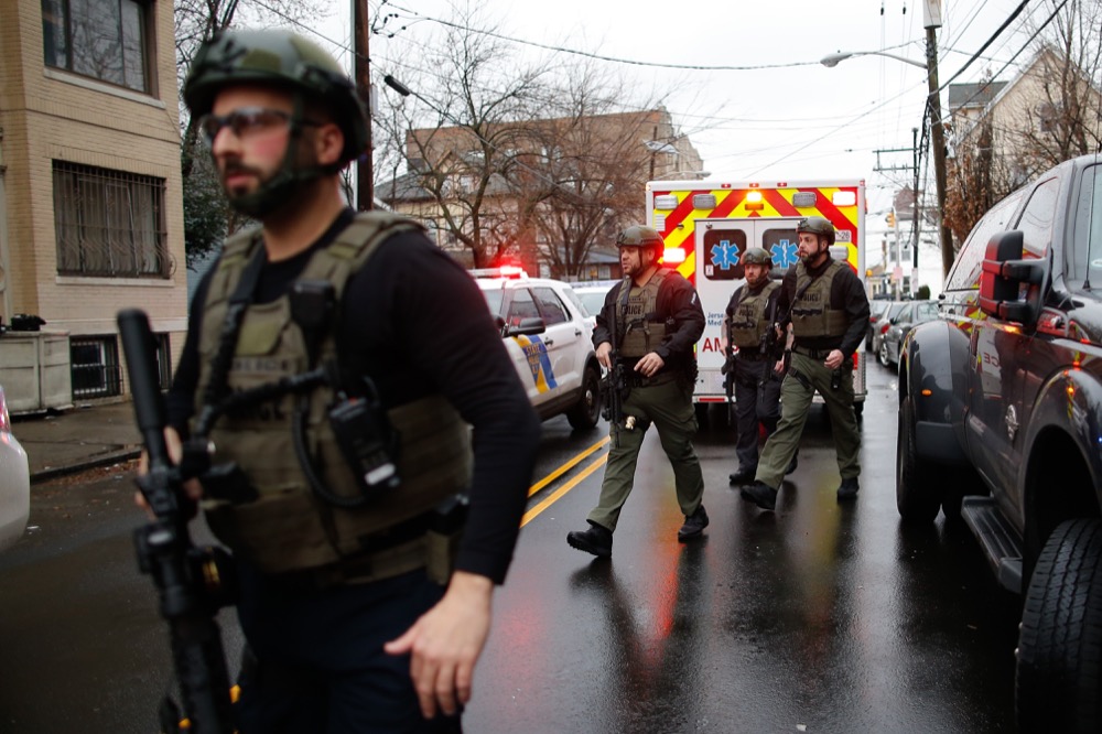 Antiterrorism unit arrive to the scene of a shooting in Jersey City, Tuesday, Dec. 10, 2019, in New Jersey. (AP Photo/Eduardo Munoz Alvarez)