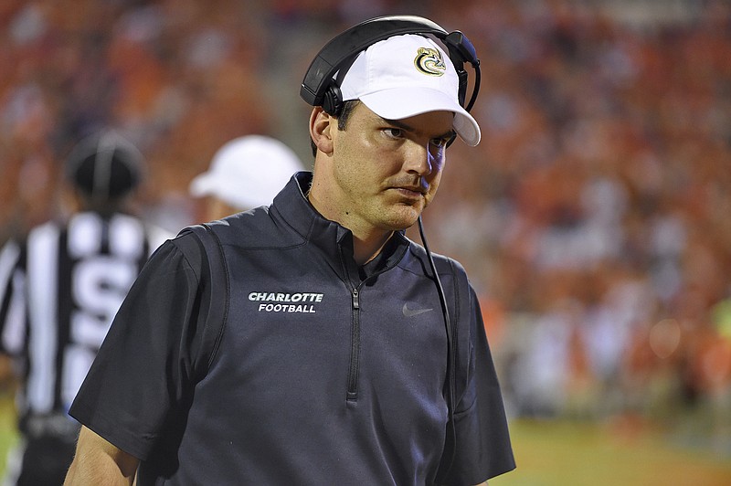 Charlotte first-year football coach Will Healy, shown here during a loss at Clemson in late September, has guided the 49ers to the first bowl game in their short history. / AP photo/Richard Shiro