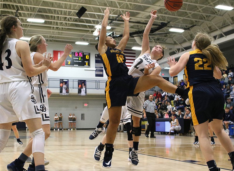 Staff photo by Erin O. Smith / Walker Valley's Tasia Roberts (10) and Soddy-Daisy's Bailey Branam (22) go up for a rebound during the Walker Valley vs. Soddy-Daisy girls' basketball game at Soddy-Daisy High School Tuesday, December 10, 2019 in Soddy-Daisy, Tennessee.