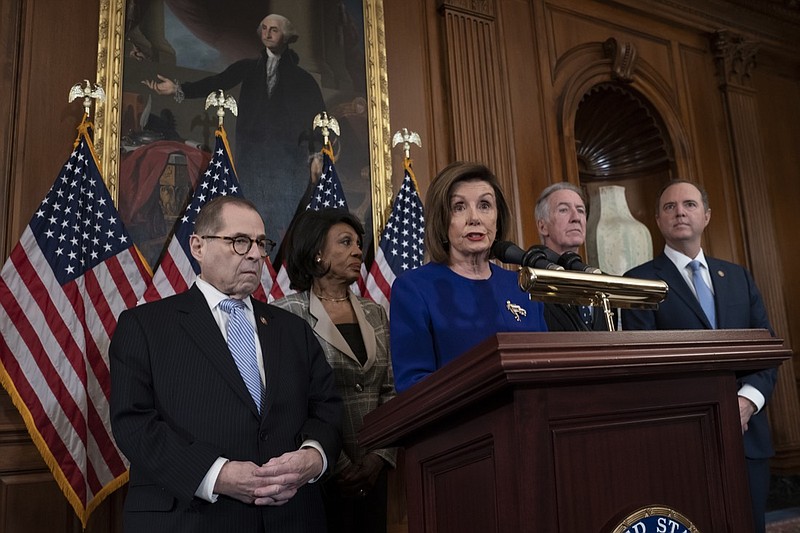 Speaker of the House Nancy Pelosi, D-Calif., joined from left by House Judiciary Committee Chairman Jerrold Nadler, D-N.Y., House Financial Services Committee Chairwoman Maxine Waters, D-Calif., House Ways and Means Committee Chairman Richard Neal, D-Mass., and House Intelligence Committee Chairman Adam Schiff, D-Calif., unveils articles of impeachment against President Donald Trump, abuse of power and obstruction of Congress, at the Capitol in Washington, Tuesday, Dec. 10, 2019. (AP Photo/J. Scott Applewhite)