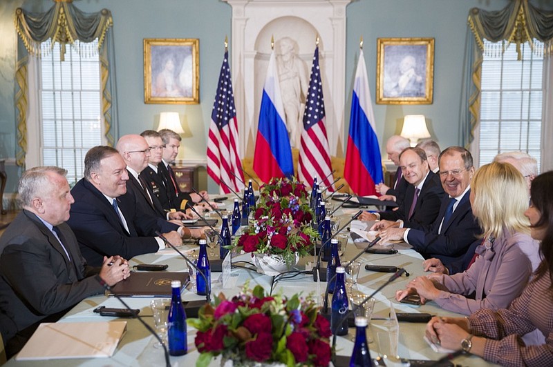 Secretary of State Mike Pompeo, second from left, is seated with Russian Foreign Minister Sergey Lavrov, second from right, before their meeting at the State Department, Tues. Dec. 10, 2019 in Washington. (AP Photo/Alex Brandon)


