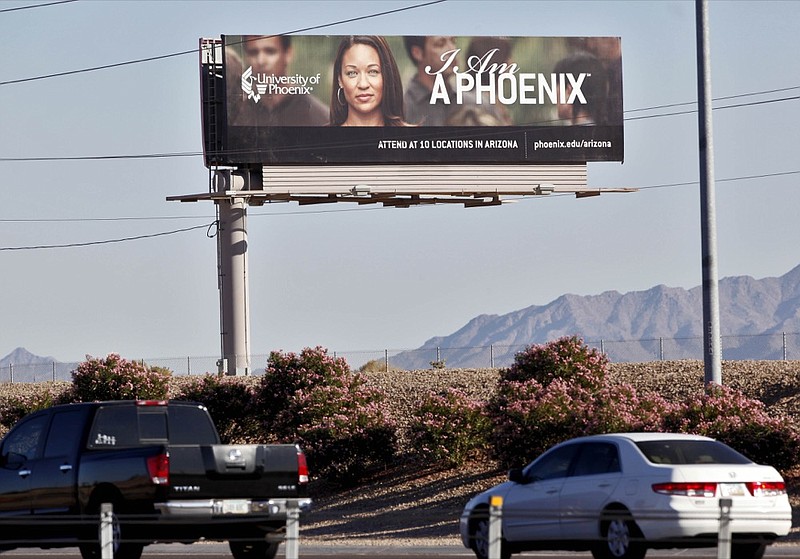 FILE - In this Nov 24, 2009, file photo, a University of Phoenix billboard is shown in Chandler, Ariz. (AP Photo/Matt York, File)


