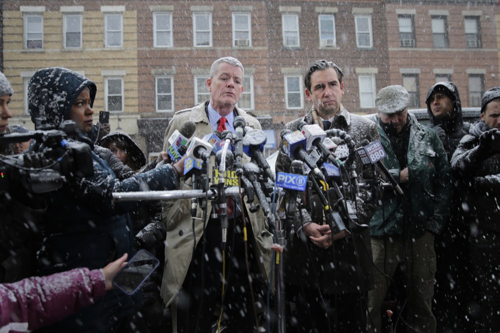 Jersey City’s mayor Steven Fulop, right, and the Director of Public Safety James Shea talk to reporters across the street from a kosher supermarket in Jersey City, N.J., Wednesday, Dec. 11, 2019. Fulop says gunmen targeted the kosher market during a shooting that killed six people Tuesday. (AP Photo/Seth Wenig)