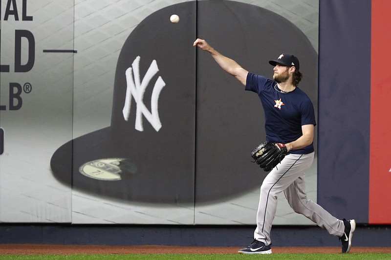 Gerrit Cole throws at Yankee Stadium on Oct. 14 as the Houston Astros practice ahead of an ALCS game in New York. Cole and the New York Yankees agreed to a record $324 million, nine-year deal late Tuesday, a person familiar with the contract told The Associated Press. / AP photo by Kathy Willens