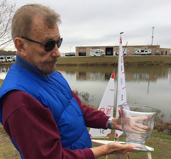 Staff Photo by Mark Kennedy / Skip Steagal, of Dayton, Tenn., shows off his national championship model sailboat trophy.