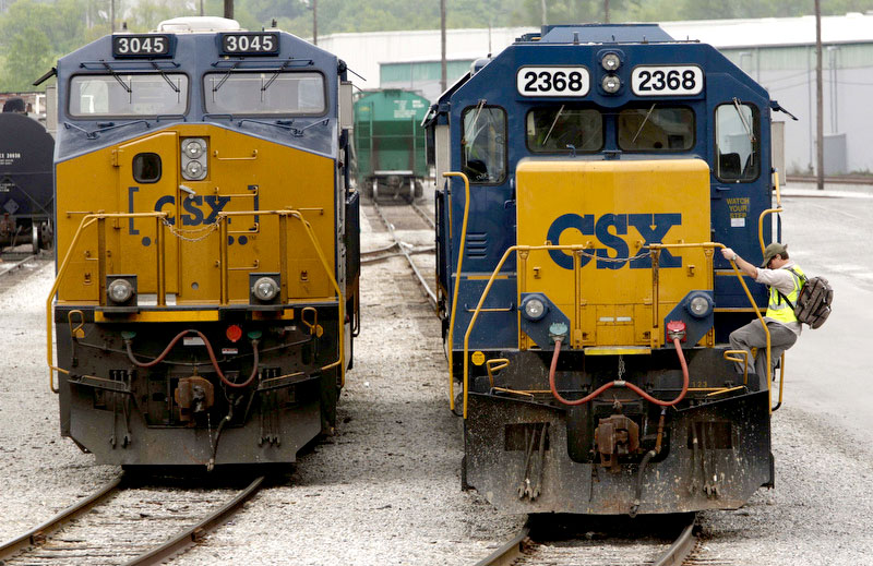 Staff Photo by Dan Henry - 4/24/13. Engineer Josh Taylor, right, exits an engine waiting to be built at CSX Transportation's Wauhatchie Yard in Lookout Valley early Wednesday morning.