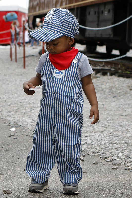 Staff photo by C.B. Schmelter /
Eighteen-month-old Kofi Williams looks down at his ticket after having it torn before boarding the train to ride with Thomas the Tank Engine during Day Out With Thomas at the Tennessee Valley Railroad Museum on Sunday, May 12, 2019 in Chattanooga, Tenn. The event continues this weekend, May 18th and 19th, from 9 a.m. until 6 p.m. Tickets can be purchased online at the Tennessee Valley Railroad's website or over the phone at 866-468-7630.