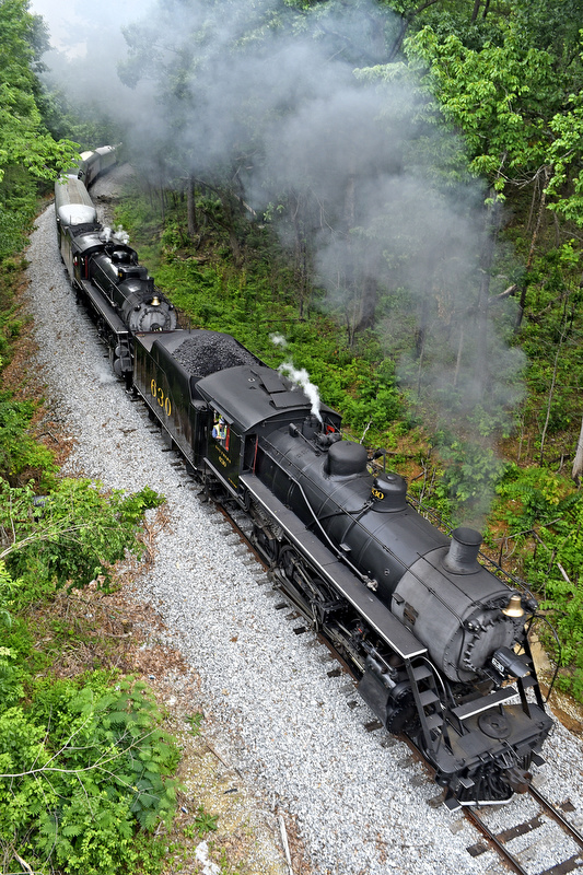 Staff Photo by Robin Rudd /
The Tennessee Valley Railroad Museum's Summerville Steam Special makes it's way up Missionary Ridge as it prepares to duck under the Highway 2 bridge on the southbound journey. The Special was a doubleheader lead by Engines 630 and 4501 on track formely owned by Central of Georgia Railroad and are now used by the Chattooga and Chickamauga Railway on June 3, 2017.