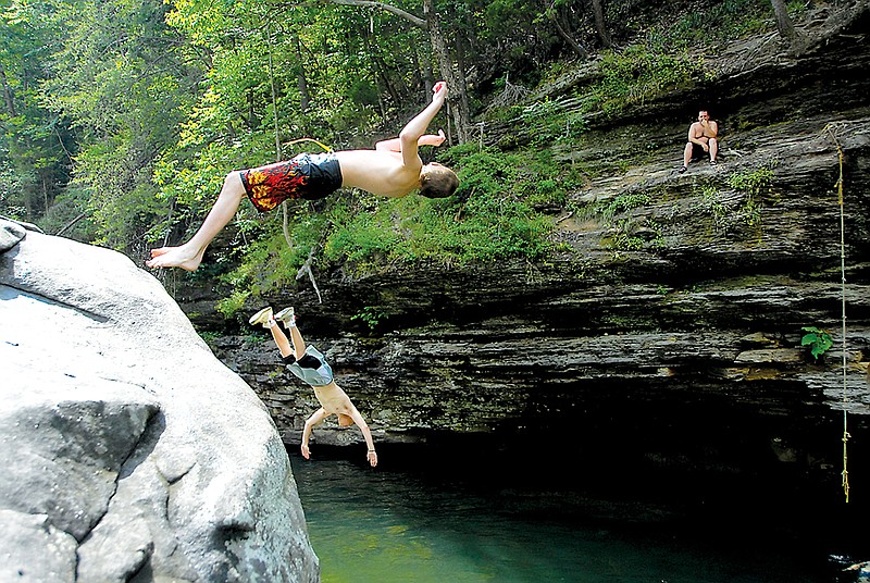 Staff File Photo / Friends dive off of a rock into a blue hole on North Chickamauga Creek in Soddy-Daisy, part of the scenic beauty that makes Hamilton County unique.