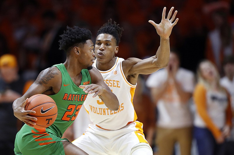 Tennessee's Yves Pons guards Florida A&M forward Bryce Moragne during a Dec. 4 game in Knoxville. / AP photo by Wade Payne