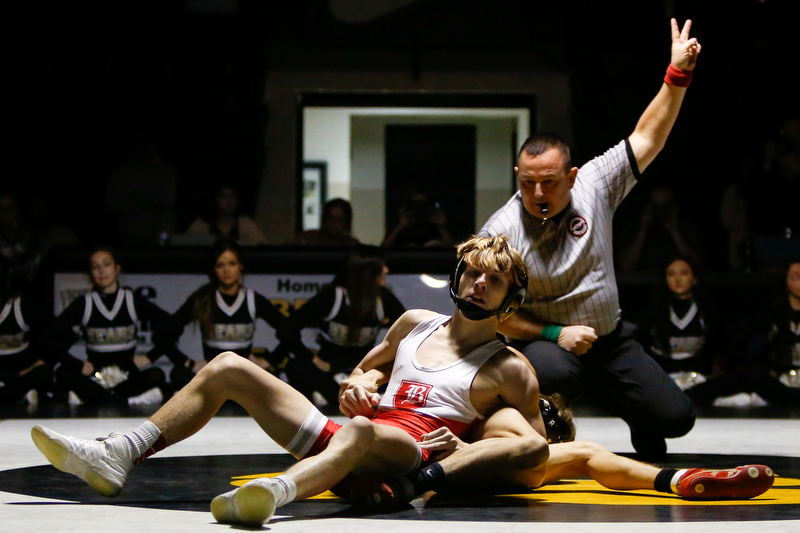 Staff photo by C.B. Schmelter / Baylor's Nick Corday, top, and Bradley Central's Ethan Wilson wrestle during a 106-pound bout in Bradley Central High School's Jim Smiddy Arena on Thursday, Dec. 12, 2019 in Cleveland, Tenn. Corday won the bout.