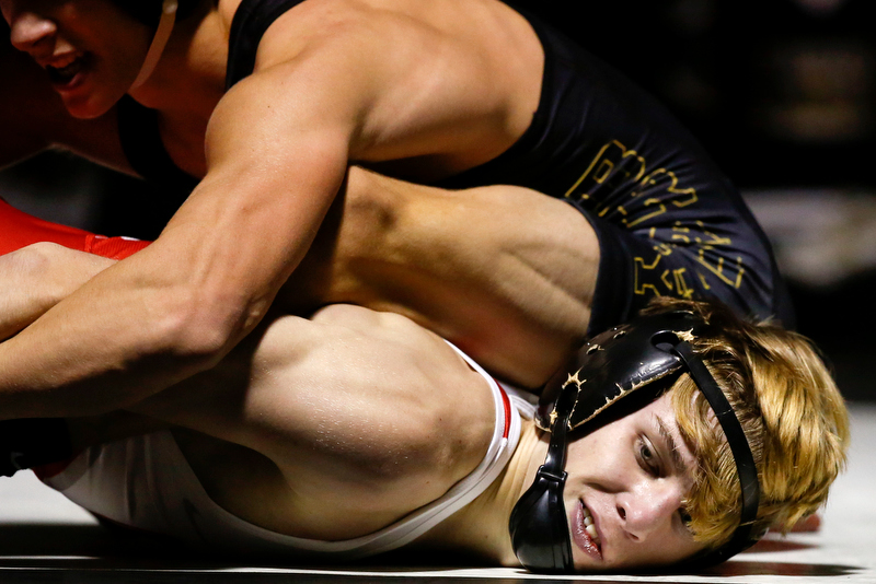 Staff photo by C.B. Schmelter / Baylor's Nick Corday, right, and Bradley Central's Ethan Wilson wrestle during a 106-pound bout in Bradley Central High School's Jim Smiddy Arena on Thursday, Dec. 12, 2019 in Cleveland, Tenn. Corday won the bout.