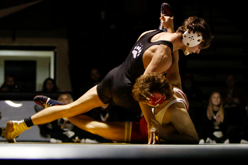 Staff photo by C.B. Schmelter / Bradley Central's Gaven Hughes, left, works against Baylor's Noah Horst during a 132-pound bout in Bradley Central High School's Jim Smiddy Arena on Thursday, Dec. 12, 2019 in Cleveland, Tenn. Horst won the bout.