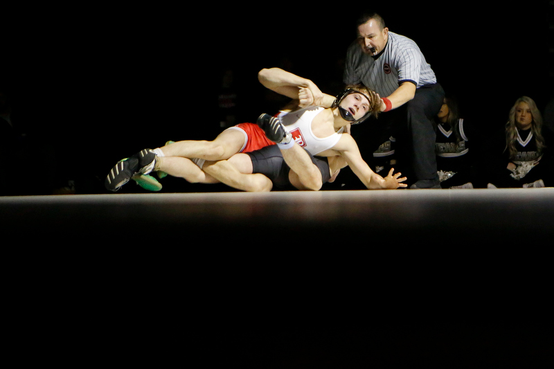 Staff photo by C.B. Schmelter / Baylor's Garrison Dendy, top, wrestles against Bradley Central's Seth Gregory during a 138-pound bout in Bradley Central High School's Jim Smiddy Arena on Thursday, Dec. 12, 2019 in Cleveland, Tenn. Dendy won the bout.