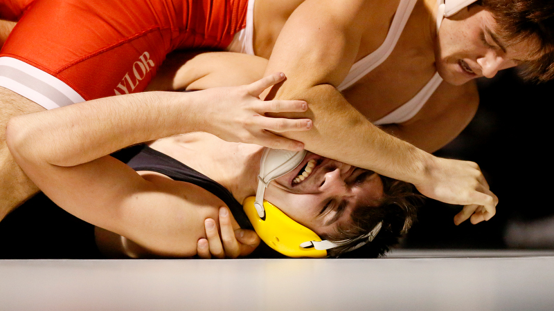 Staff photo by C.B. Schmelter / Bradley Central's Carson Parker struggles against Baylor's Chase Radpour during a 145-pound bout in Bradley Central High School's Jim Smiddy Arena on Thursday, Dec. 12, 2019 in Cleveland, Tenn. Radpour won the bout.