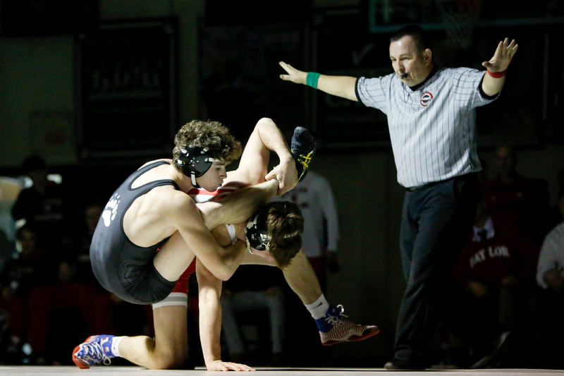 Bradley Central's Chase Stansberry, left, and Baylor's Anthony Manella fight for control during the 160-pound match Thursday night at Jim Smiddy Arena in Cleveland, Tenn. Manella won 9-0 to help the Red Raiders to a 49-15 victory in the dual meet. / Staff photo by C.B. Schmelter