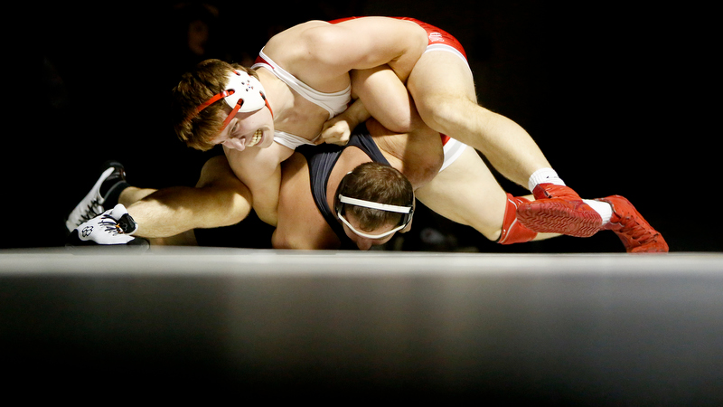 Staff photo by C.B. Schmelter / Baylor's Barrett Chambers, top, wrestles against Bradley Central's Gavin Sewell during a 220-pound bout in Bradley Central High School's Jim Smiddy Arena on Thursday, Dec. 12, 2019 in Cleveland, Tenn. Chambers won the bout.