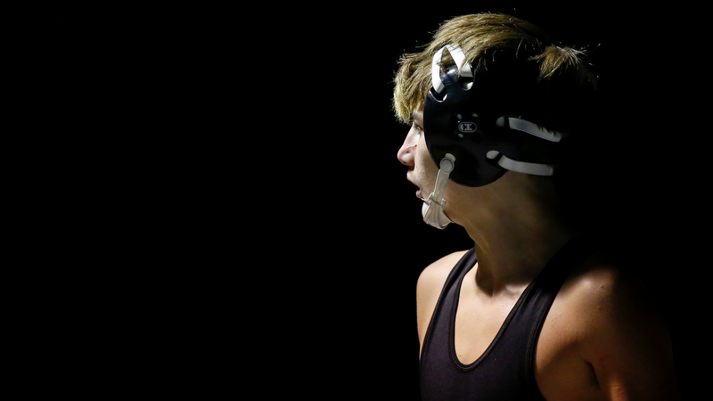 Staff photo by C.B. Schmelter / A cut is seen on Bradley Central's Taron Patterson's nose during his 126-pound bout against Baylor's Micah Tisdale in Bradley Central High School's Jim Smiddy Arena on Thursday, Dec. 12, 2019 in Cleveland, Tenn. Patterson would win the bout.