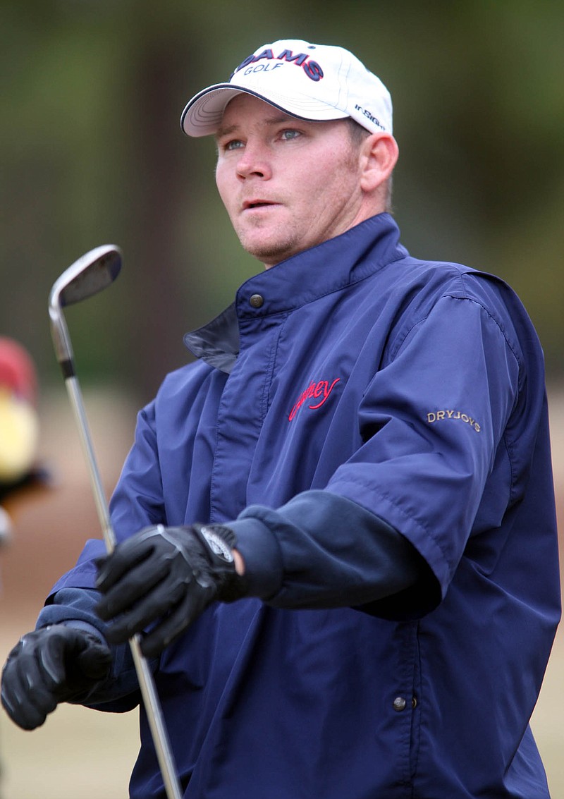 Golfer Tommy Gainey watches his ball after hitting a tee shot at Hartsville Country Club on Wednesday, Dec. 19, 2007 in Hartsville, S.C.(AP Photo/Willis Glassgow)
