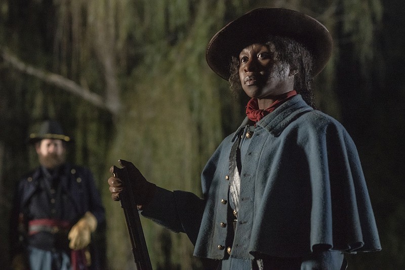 This image released by Focus Features shows Cynthia Erivo as Harriet Tubman in a scene from "Harriet." On Monday, Dec. 9, 2019, Erivo was nominated for a Golden Globe for best actress in a motion picture drama for her role in the film. (Glen Wilson/Focus Features via AP)


