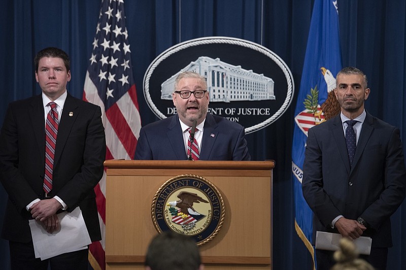 Assistant Attorney General Brian Benzkowski, center, U.S. Attorney Robert Duncan, Eastern District of Kentucky, right, and FBI Special Agent George Piro, in charge of the FBI Miami Field Office, appear at a news conference Thursday at the Justice Department in Washington to announce charges against 10 former NFL players who are accused of defrauding a league health care program. / AP Photo by Cliff Owen


