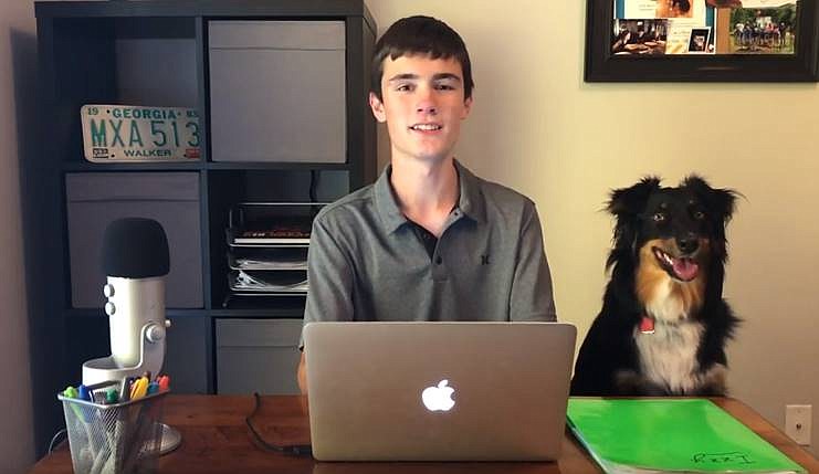 Andrew Lemons discusses his new app idea alongside his family dog, Izzy. / Screeshot of video from Andrew Lemons