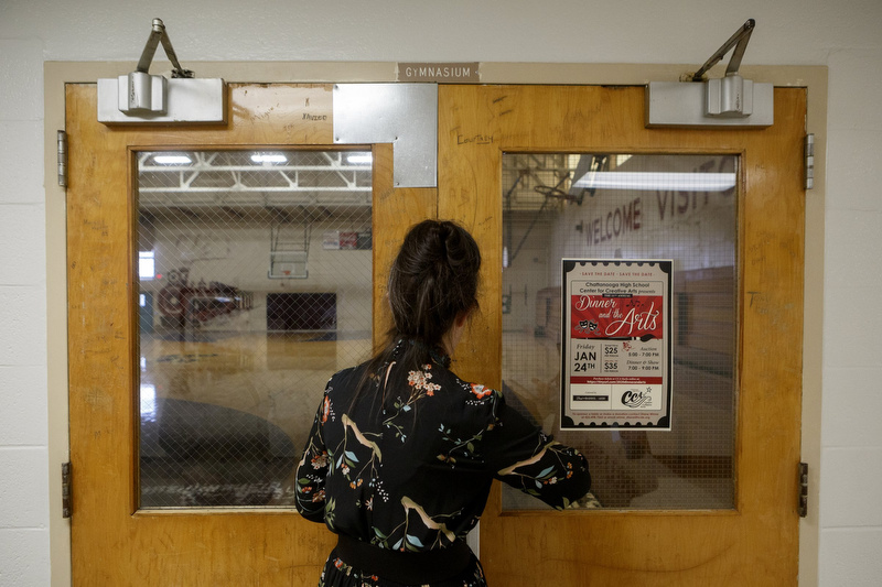 Staff photo by C.B. Schmelter / Dean of Fine Arts Sally White unlocks the gym during a tour of Chattanooga Center for Creative Arts on Tuesday, Dec. 10, 2019 in Chattanooga, Tenn.