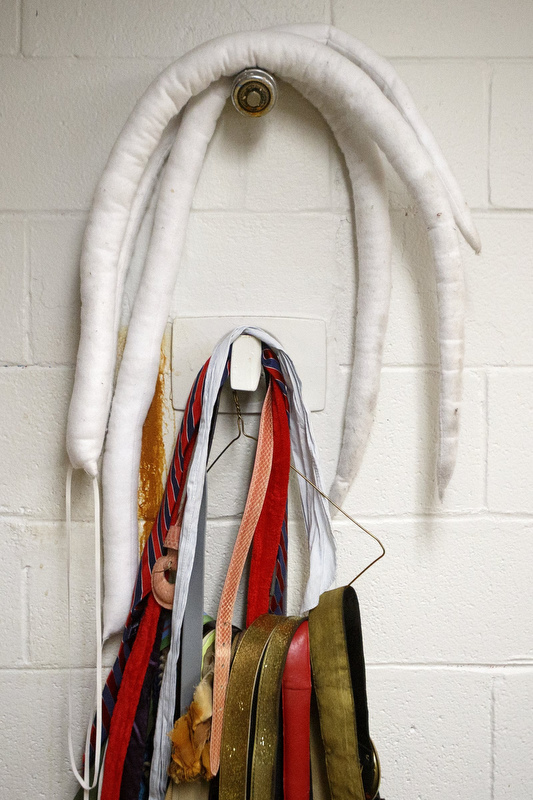 Staff photo by C.B. Schmelter / Parts of costumes are hung in an old shower at Chattanooga Center for Creative Arts on Tuesday, Dec. 10, 2019 in Chattanooga, Tenn.