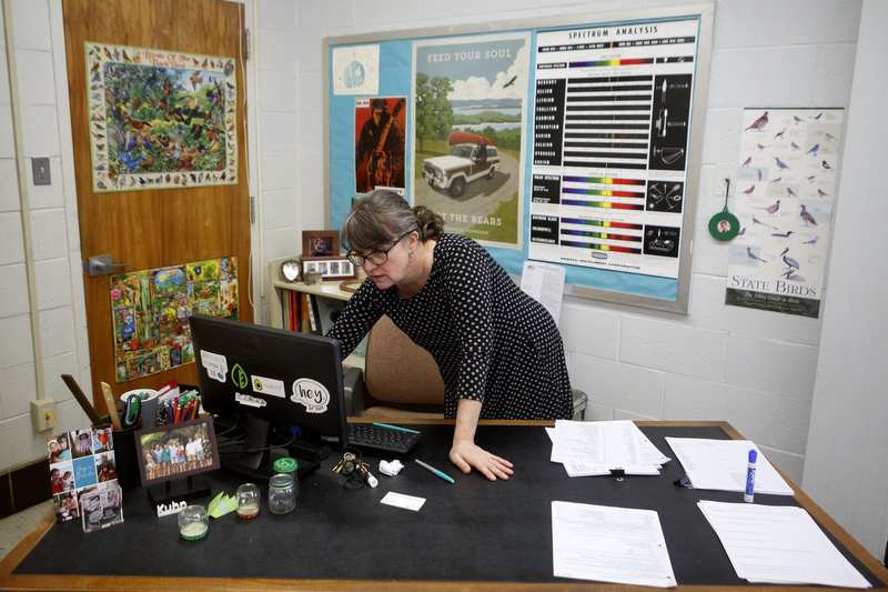 Staff photo by C.B. Schmelter / Science teacher Kelley Kuhn checks her computer at Chattanooga Center for Creative Arts on Tuesday, Dec. 10, 2019 in Chattanooga, Tenn.