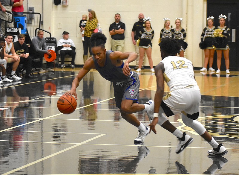 Cleveland's JaCobi Wood breaks past a defender during his fourth-quarter takeover Friday night at Bradley Central. / Staff photo by Patrick MacCoon