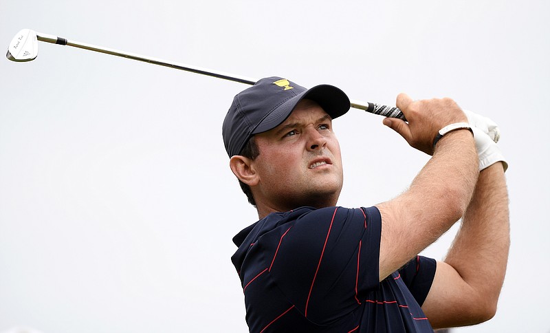 U.S. team member Patrick Reed hits on the 14th hole in a fourball match during the Presidents Cup on Saturday at Royal Melbourne Golf Club in Australia. / AP photo by Andy Brownbill