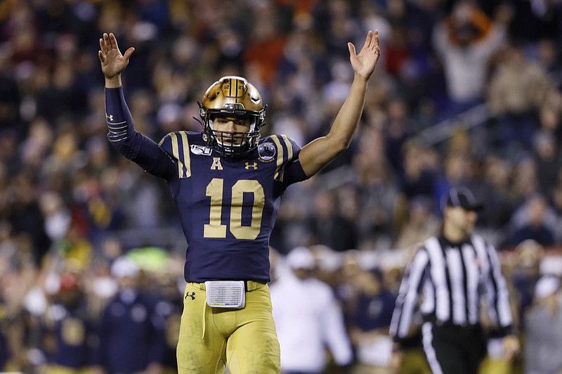 Navy quarterback Malcolm Perry celebrates after a touchdown during the second half of Saturday's game against Army in Philadelphia. / AP photo by Matt Slocum